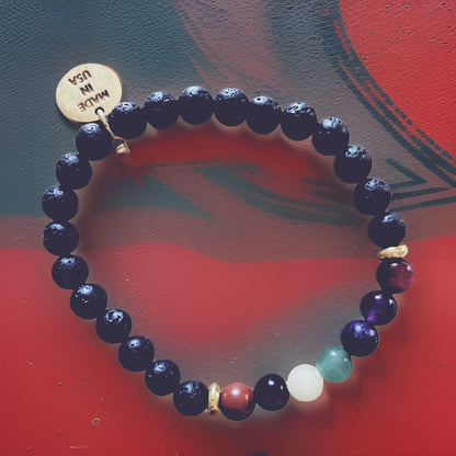 Small Black Lava Rock Chakra Bracelet by The Urban Charm