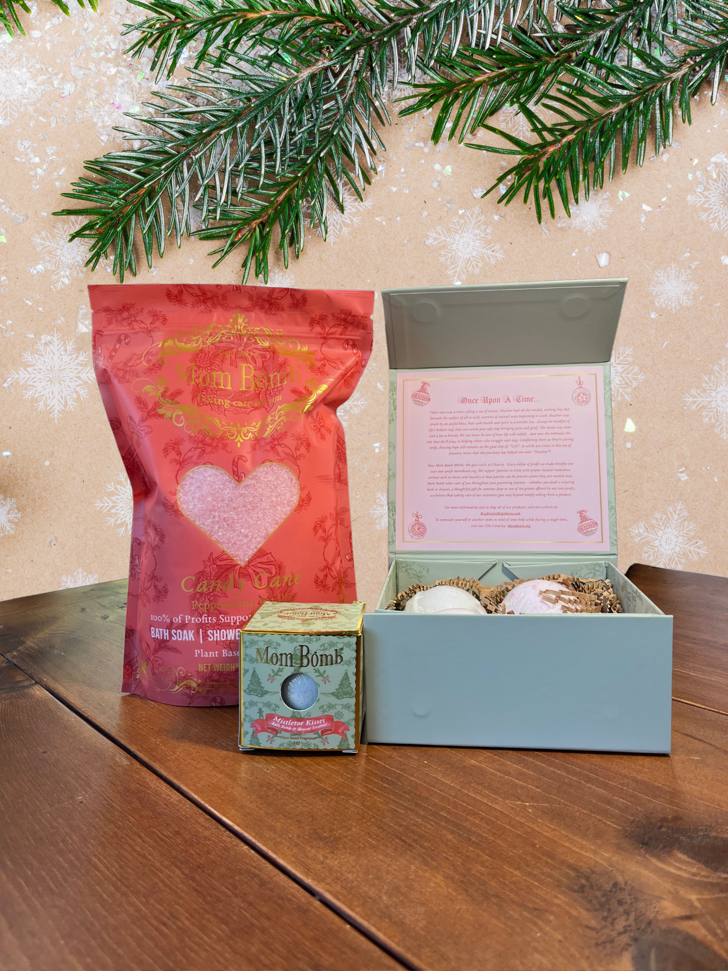 Mom Bomb Holiday Cheer Bundle – Deck the Halls Edition comes with our Evergreen Holiday Bath Bomb Gift Set,3lb Candy Cane Bath Salts, and Mistletoe Kisses 5oz Bath Bomb